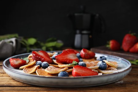 Cereal pancakes with berries on wooden tableの写真素材