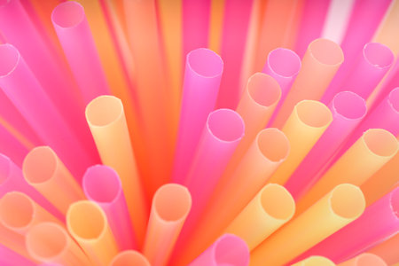 Heap of colorful plastic straws for drinks as background, closeupの写真素材