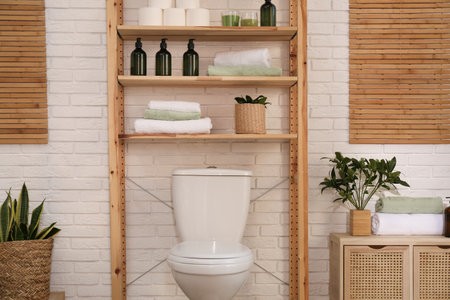 Stylish bathroom interior with toilet bowl and other essentialsの写真素材