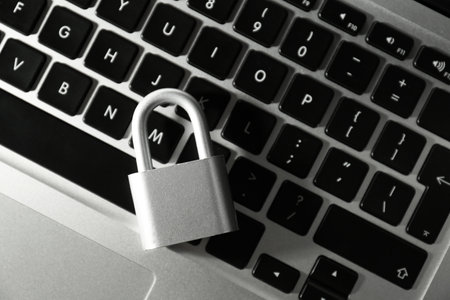 Metal lock on laptop, top view. cyber security conceptの写真素材