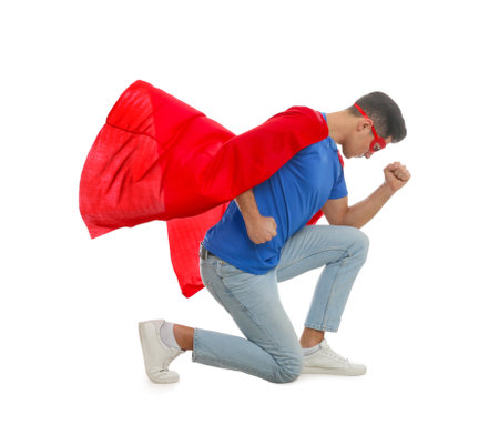 Man wearing superhero cape and mask on white backgroundの写真素材