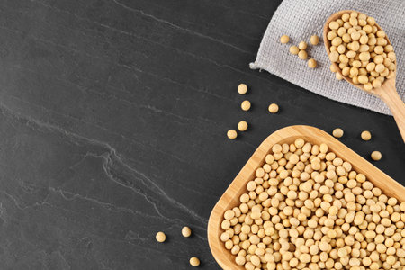 Soy on black table, flat lay. Space for textの写真素材