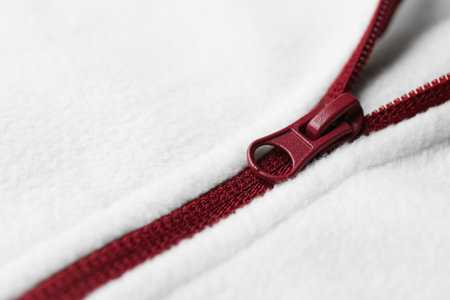 White woolen sweatshirt with zipper as background, closeup viewの写真素材