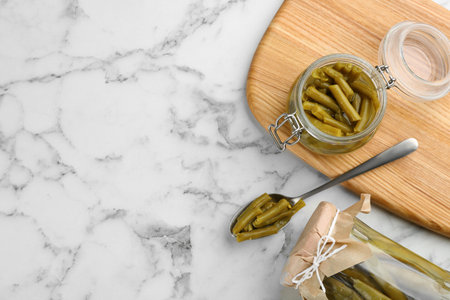 Canned green beans on white marble table, flat lay. Space for textの写真素材