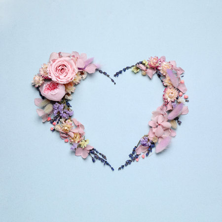 Beautiful heart shaped floral composition on light background, flat layの写真素材