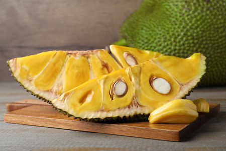 Slices of delicious exotic jackfruit on wooden tableの写真素材
