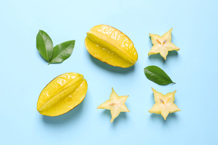 Delicious carambola fruits on light blue background, flat layの写真素材