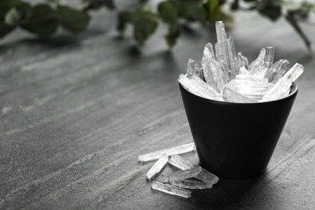 Menthol crystals on gray background. Space for textの写真素材