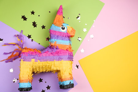 llama shaped pinata and glitter on color background, flat lay. Space for textの写真素材