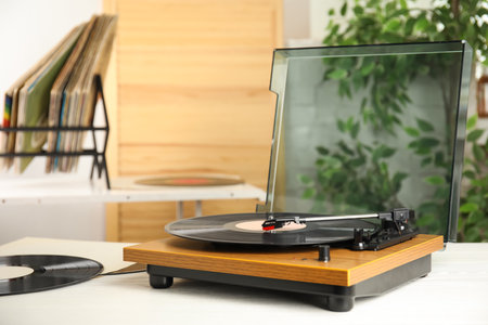 Stylish turntable and vintage vinyl records indoorsの写真素材