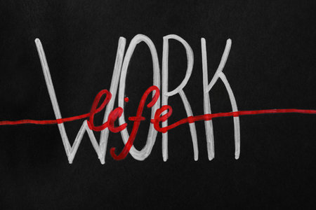 Words Work and Life written on black page. balance conceptの写真素材