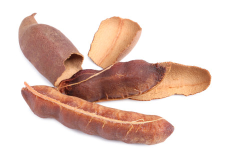 Delicious ripe tamarinds on white background. exotic fruitsの写真素材