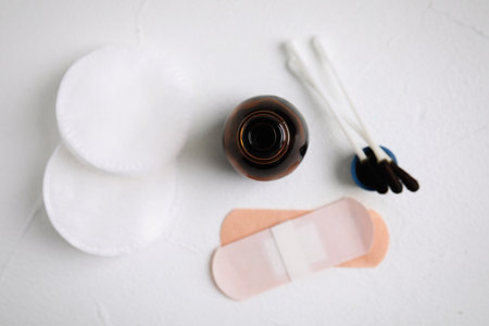 Flat lay composition with bottle of medical iodine on white tableの写真素材