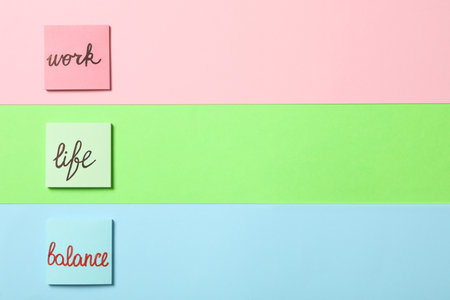 Different sticky notes on color background with space for text, flat lay. Life and work balance conceptの写真素材
