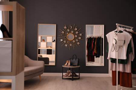 Stylish women's clothes and accessories in modern boutiqueの写真素材