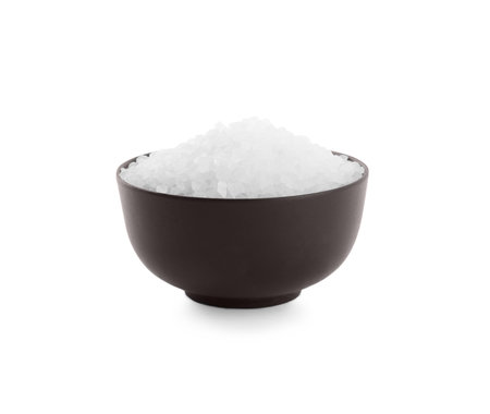 Natural salt in bowl isolated on whiteの写真素材