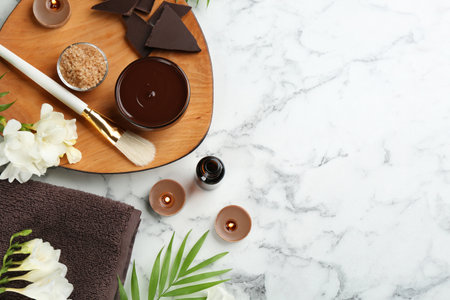 Flat lay composition with cosmetic product on white marble background, space for text. Spa body wrapsの写真素材