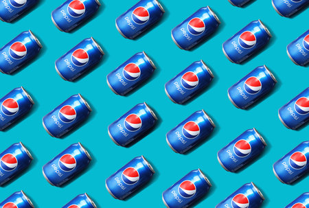 MYKOLAIV, UKRAINE - FEBRUARY 10, 2021: Cans of Pepsi on light blue background, flat layのeditorial素材