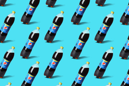 MYKOLAIV, UKRAINE - FEBRUARY 10, 2021: Bottles of Pepsi on turquoise backgroundのeditorial素材