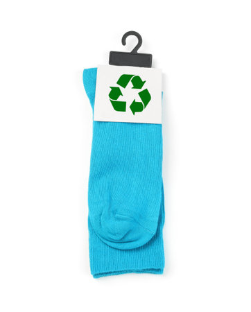 Blue socks with recycling label on white background, top viewの写真素材