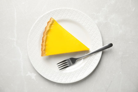 Delicious homemade lemon pie on light gray marble table, top viewの写真素材