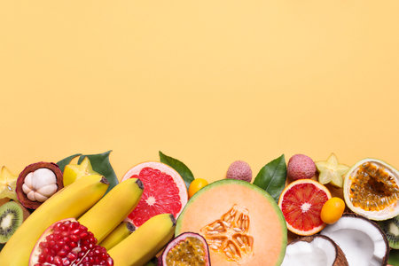 Different exotic fruits on beige background, flat lay. Space for textの写真素材