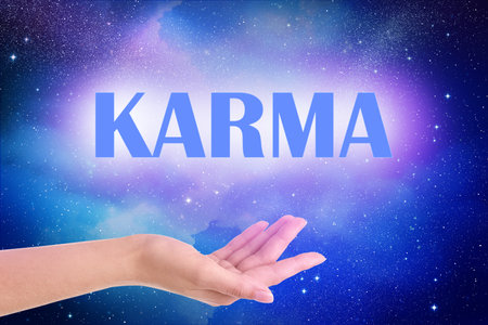 Karma concept. Woman against starry sky in night, closeup of handの写真素材
