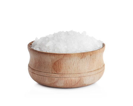 Natural salt in bowl isolated on whiteの写真素材