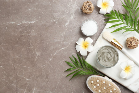 Flat lay composition with cosmetic product on gray background, space for text. Spa body wrapsの写真素材