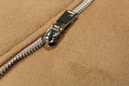 Beige jacket with zipper as background, closeup viewの写真素材