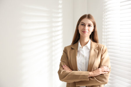 Portrait of beautiful young businesswoman in officeの写真素材