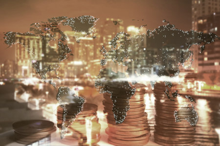 Multiple exposure of coins, world map and cityscape. online payment conceptの写真素材