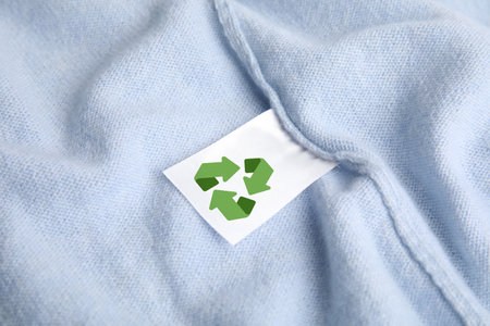 Clothing label with recycling label on cashmere sweater, closeupの写真素材