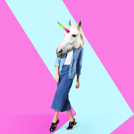 modern art collage. Woman with unicorn's head on color backgroundの写真素材