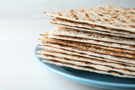 Stack of matzos on white table, closeupの写真素材