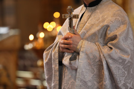 Priest holding cross in church, closeup. Baptist ceremonyの写真素材