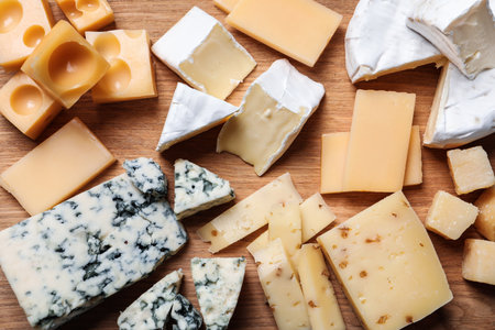 Cheese plate on wooden board, top viewの写真素材