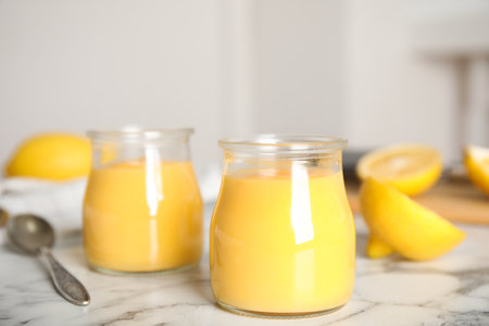 Delicious lemon curd on white marble tableの写真素材