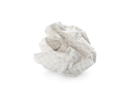 Crumpled sheet of notebook paper isolated on whiteの写真素材