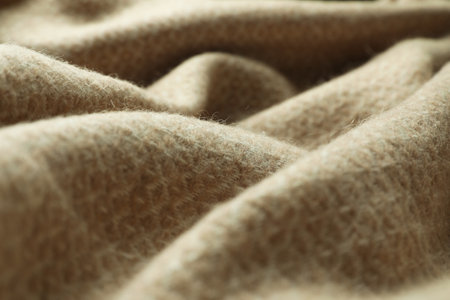 Beige woolen fabric with geometrical pattern, closeupの写真素材