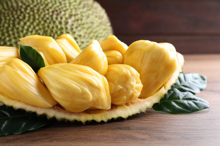 Fresh exotic jackfruit bulbs on wooden table, closeupの写真素材