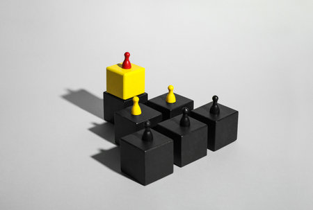 Cubes with game pieces on light gray backgroundの写真素材