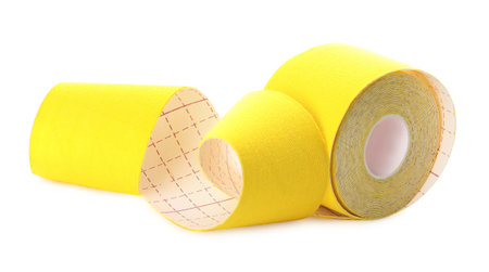 Yellow kinesiology tape in roll on white backgroundの写真素材