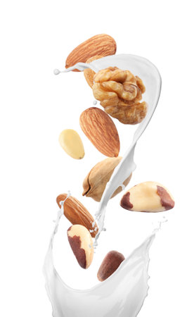 Delicious natural nut milk on white backgroundの写真素材