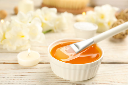 Cosmetic product for spa body wraps on white wooden background, closeupの写真素材