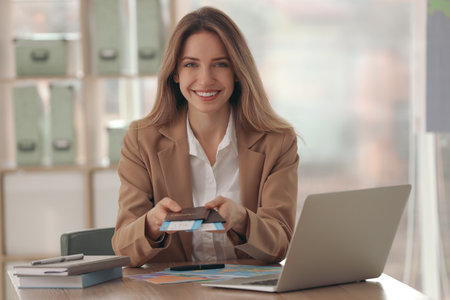 Travel agent with tickets and passports in officeの写真素材
