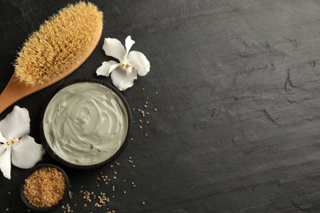 Flat lay composition with cosmetic product on black background, space for text. Spa body wrapsの写真素材