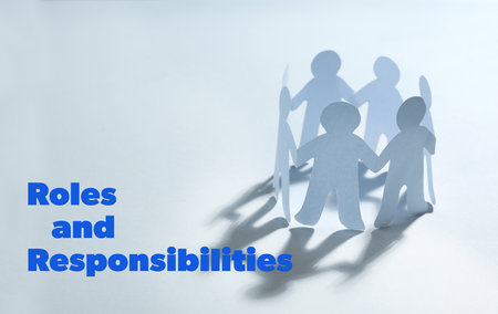Roles and Responsibilities. Paper people chain making circle on light backgroundの写真素材