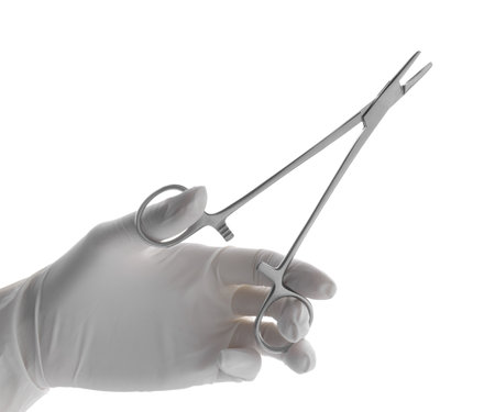 Doctor holding surgical forceps on white background, closeup. medical instrumentsの写真素材
