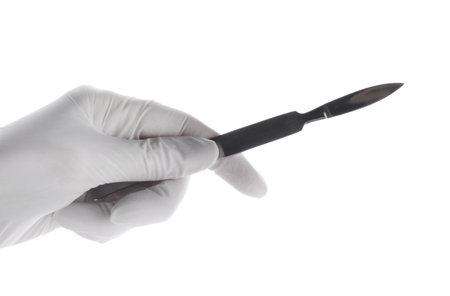 Doctor holding surgical scalpel on white background, closeup. medical instrumentsの写真素材